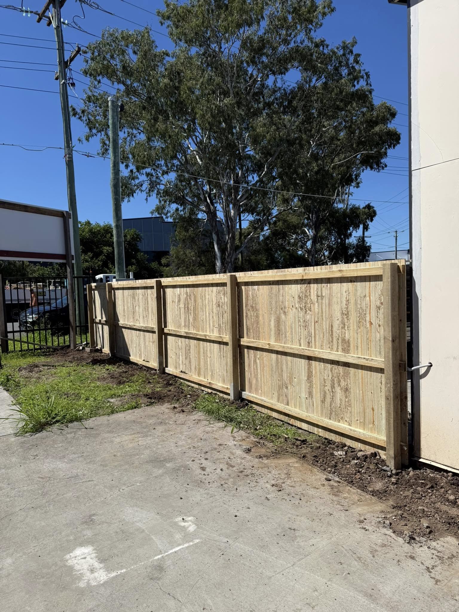 landscape professionally landscaped backyard with stone retaining wall